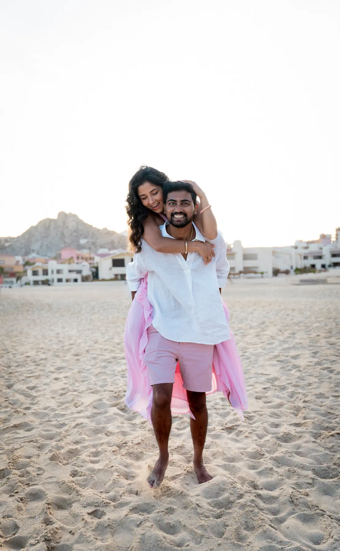 Lata on Naga's back on the sand at Solmar Beach