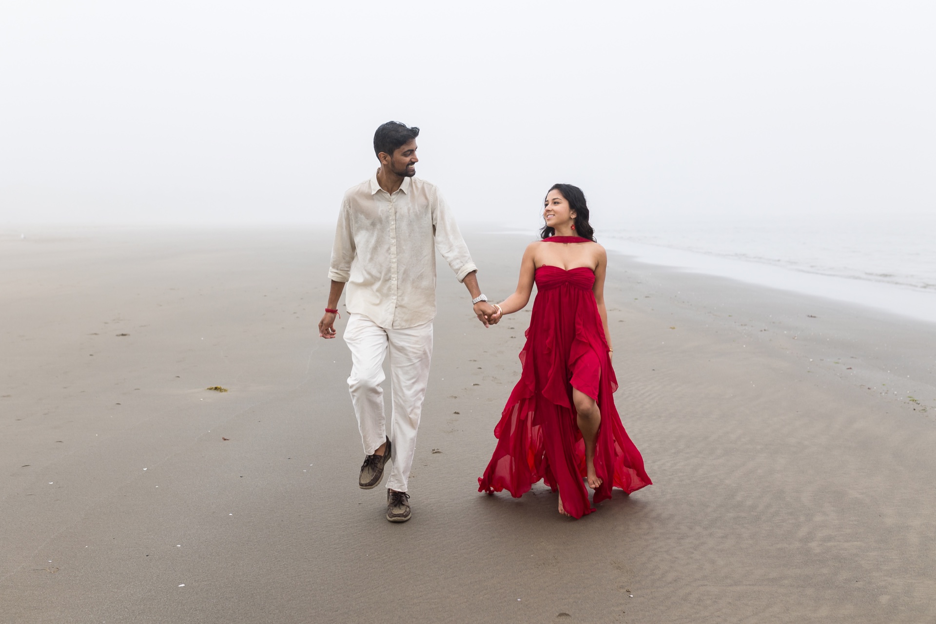 Naga and Lata walking together on the beach